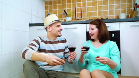 Happy couple social distancing while having party at home with wine and confetti Stock Footage 132291004