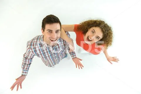 The happy couple stand on the white background. View from above Stock Photos