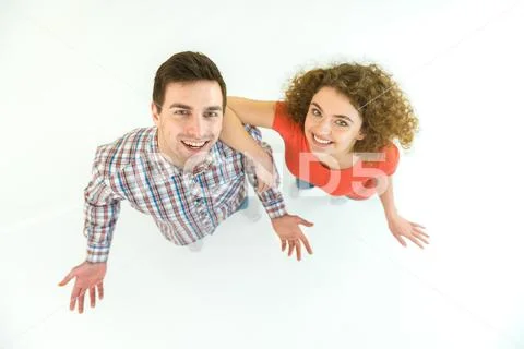 The happy couple stand on the white background. View from above Stock Photos