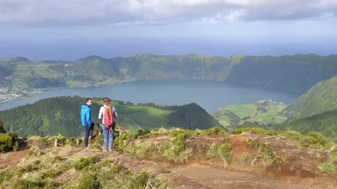 Happy Couple Standing At Boca Do Inferno Lookout, Sete Cidades, Azores Stock Footage 89778516