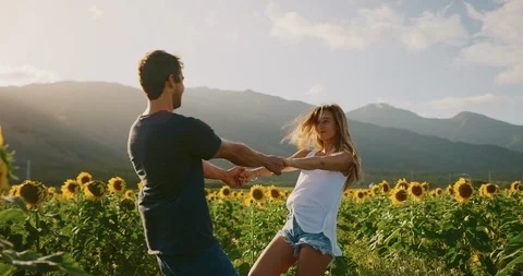 Happy couple in sunflower fields Stock Footage 106510008