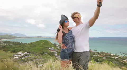 Happy couple taking selfie self-portrait photo hiking, Oahu, Hawaii Stock Footage 58146335