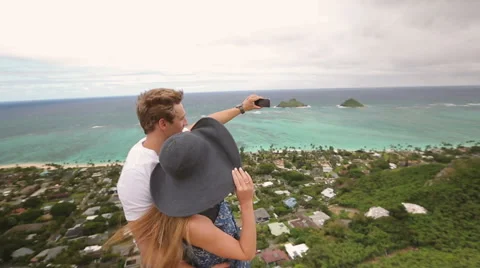 Happy couple taking selfie self-portrait photo hiking, Oahu, Hawaii Stock Footage 58146526