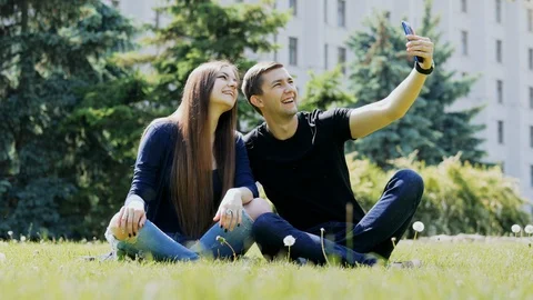 Happy couple taking selfie using smartphone. Man and woman spending time Stock Footage 108515003