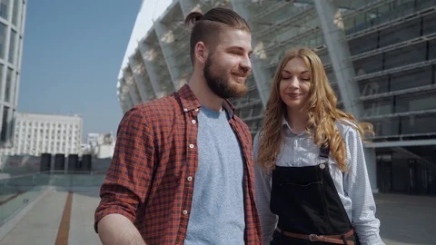 Happy couple taking selfies with smart phone standing in the street Stock Footage 110916005
