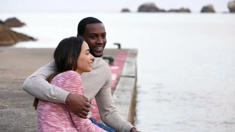 Happy couple talking on the beach Stock Footage 186191125