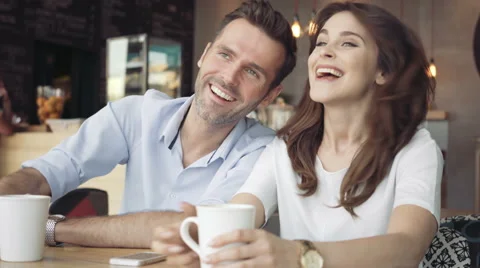 Happy couple talking at cafe Stock Footage 64652371