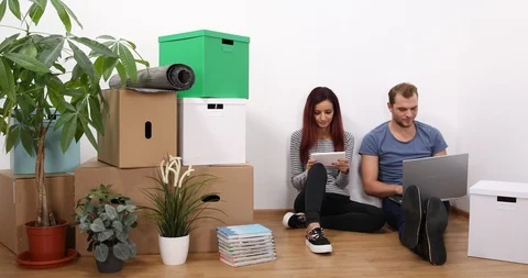 Happy Couple Talking Using Laptop and Digital Tablet Activity Team Living Home Stock Footage 87908880