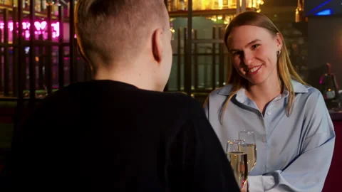 Happy couple talking while enjoying musical show at restaurant Stock Footage 277034783