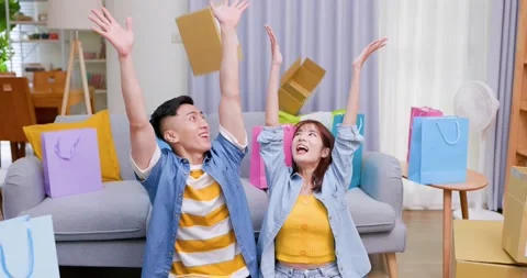 Happy couple throw delivery boxes Stock Footage 160257012
