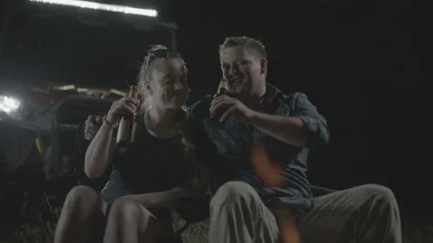 Happy Couple Toasting at Campfire Stock Footage 323405792