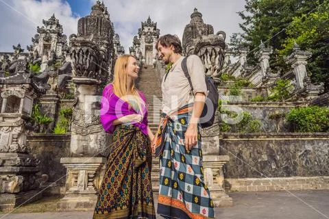 Happy couple of tourists on background of Three stone ladders in beautiful Pura Stock Photos