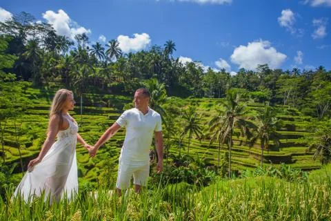 Happy couple traveling at Bali, rice terraces of Tegalalang, Ubud Stock Photos