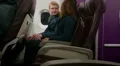 Happy couple traveling by plane on vacation, holding hands, enjoying flight HD Footage