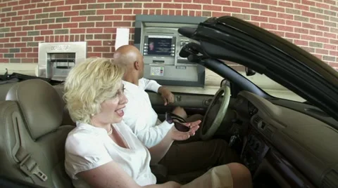 Happy Couple Use Drive-Through ATM Stock Footage 22772284