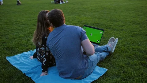 A happy couple using laptop. Ready for tracking. Stock Footage 97876299