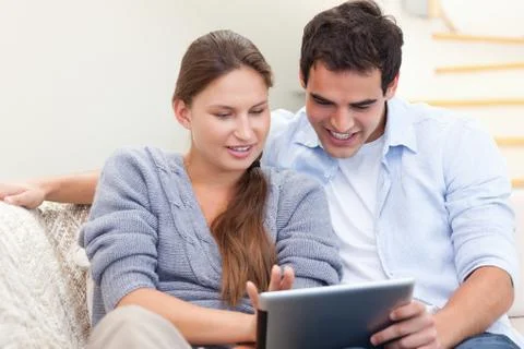 Happy couple using a tablet computer 스톡 사진