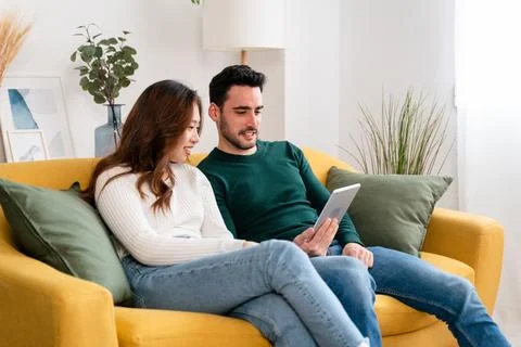 Happy couple using tablet together Stock Photos