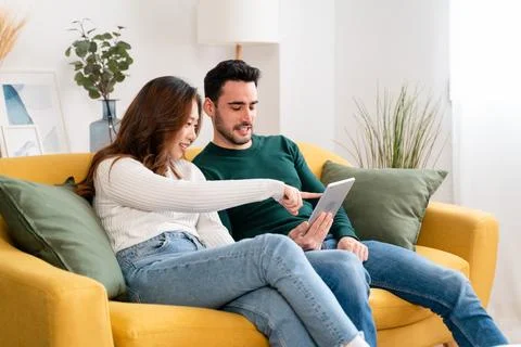 Happy couple using tablet together Stock Photos
