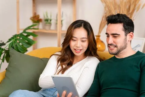 Happy couple using tablet together Stock Photos
