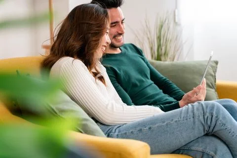 Happy couple using tablet together Stock Photos