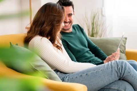 Happy couple using tablet together Stock Photos
