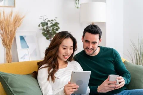 Happy couple using tablet together Stock Photos