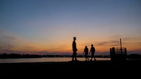 Happy Couple Walking and Talking at Sunset in Evansville Stock Footage 78026445