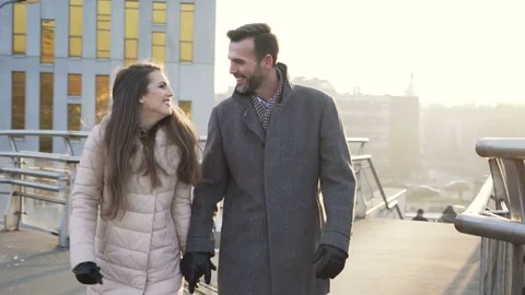 Happy couple walking during cold winter day in the city Stock Footage 70808265