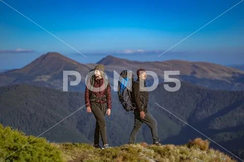The happy couple walking on the mountain Stock Photos