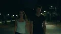 The happy couple walking in the night park. slow motion 4k or 4k+ Resolution