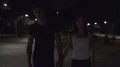 The happy couple walking in a night park. slow motion 4k or 4k+ Resolution