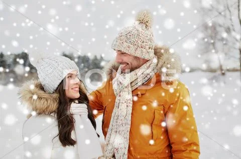 Happy couple walking over winter background Stock Photos