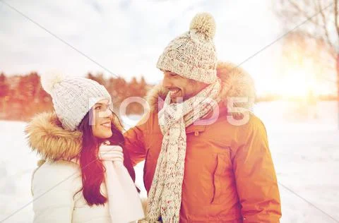 Happy couple walking over winter background Stock Photos