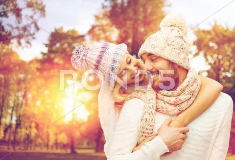 Happy couple in warm clothes over autumn Stock Photos