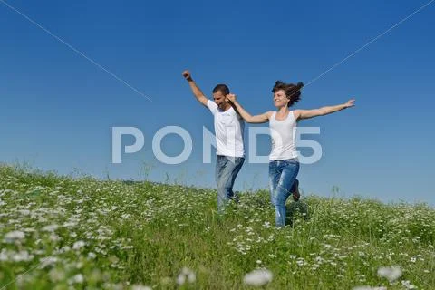 Happy couple in wheat field Stock Photos