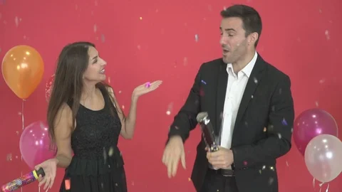 Happy couples dancing with New Year's decorations and red backgrounds. Stock Footage 121132227
