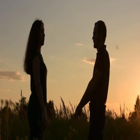 Happy couples go to meet each other. Side view under direct sunlight. At sunset. Stock Footage 69552028