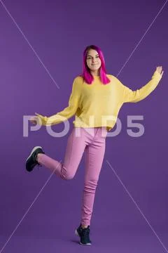 Happy crazy young girl in trendy clothes rejoicing at winning Stock Photos