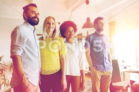 Happy creative team in office Stock Photos