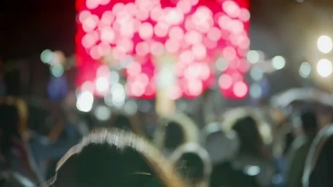 Happy crowd at the performance of their favorite band. Spectators with phones. Видео 166841106