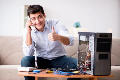 Happy customer resolving his computer problem Stock Photos