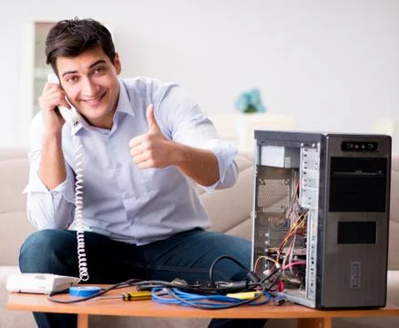 Happy customer resolving his computer problem Stock Photos