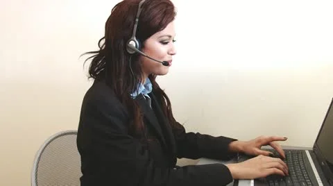 Happy customer service worker helping out at call center Stock Footage 12262004