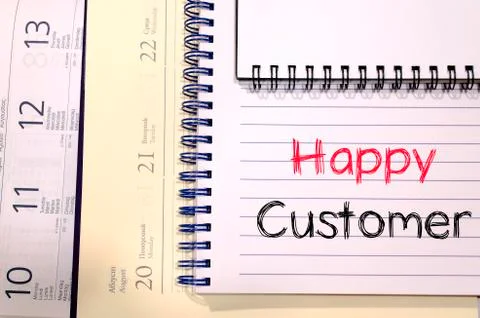 Happy customer text concept on notebook Stock Photos