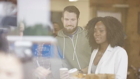 Happy customers making payment at counter of coffee shop Stock Footage 108012198