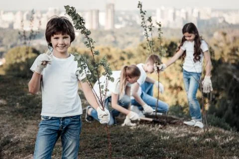 Happy cute boy saving the environment Stock Photos