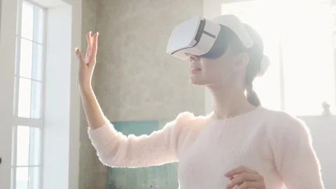 Happy cute girl using 3D virtual reality headset. Stock Footage 102734737