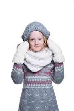 Happy cute kid posing in the studio isolated on white background. Wearing win Stock Photos