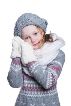 Happy cute kid posing in the studio isolated on white background. Wearing win Stock Photos
